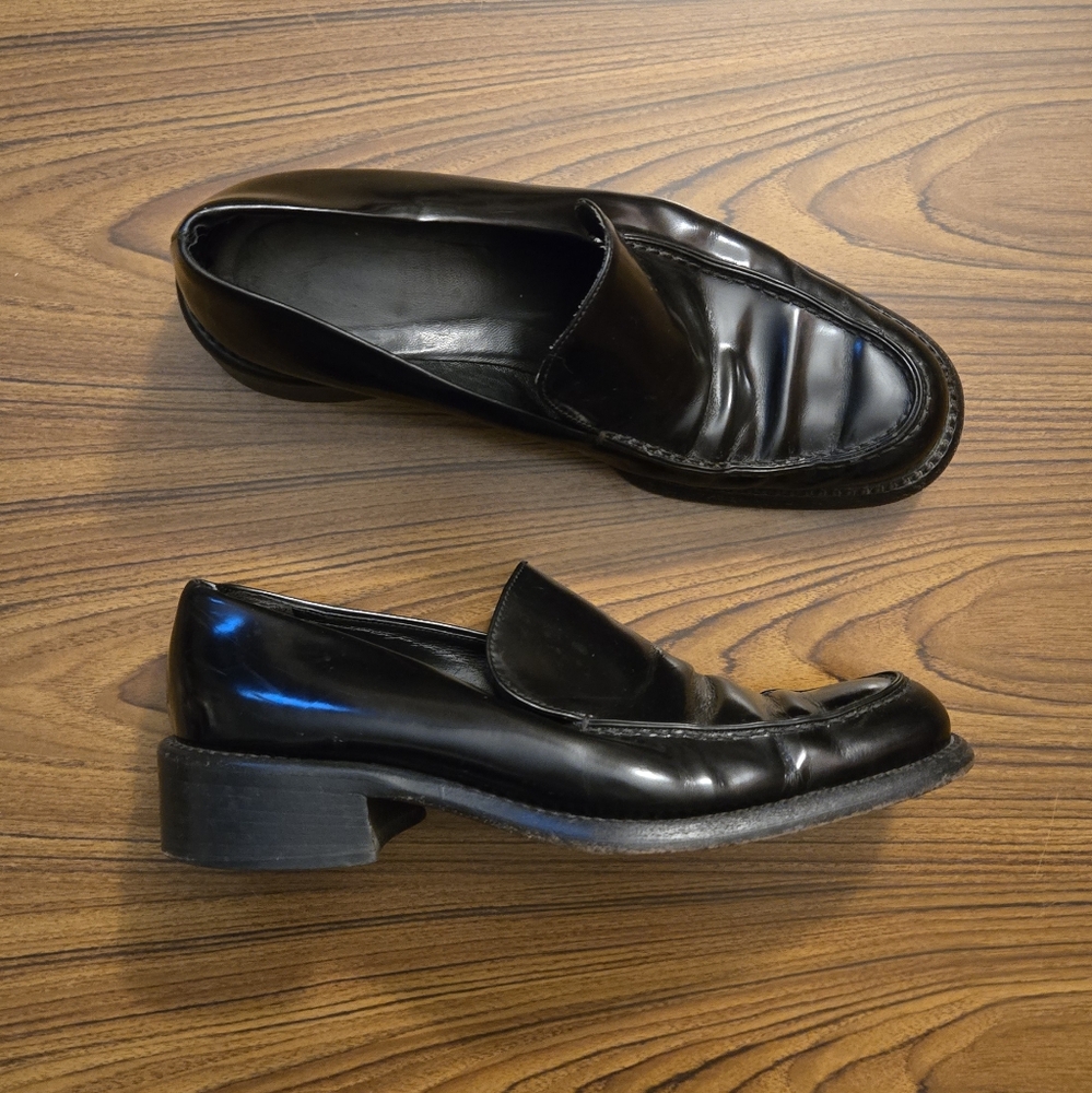 Men’s Prada black heeled loafers (mismatched)